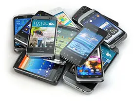 A pile of cell phones sitting on top of each other.